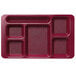 A red Cambro 6 compartment serving tray on a counter.