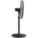A black Tornado industrial pedestal fan on a stand.
