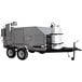 A large grey Holstein Manufacturing chicken and rib cooker on a trailer with a white tank.