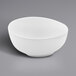A white GET Enterprises Riverstone melamine bowl on a gray surface.