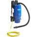 A blue and black Clarke Comfort Pak backpack vacuum with a yellow hose.