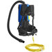 A blue and black Clarke Comfort Pak backpack vacuum with yellow attachments.