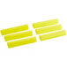 A group of yellow silicone Baker's Mark bun / sheet pan clips.