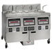 A Henny Penny natural gas commercial fryer with three wells and Computron 8000 controls.