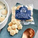 A bowl of soup with Zesta New England Style Oyster Crackers on the side.