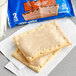 A 2-pack of Pop-Tarts Frosted Brown Sugar Cinnamon toaster pastries on a napkin.
