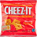 A close-up of a yellow Cheez-It Reduced Fat cracker with a hole in the middle.