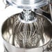 A Vollrath commercial floor mixer with a wire whisk inside.