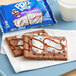A 2-pack of Pop-Tarts Frosted Hot Fudge Sundae with chocolate and white frosting on graham crackers.