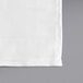 A white cloth napkin with a stitched edge.