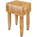 A John Boos maple butcher block table with casters.