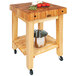 A John Boos wood butcher block table with a pot on it.