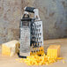 A Tablecraft stainless steel 6-sided cheese grater with a soft grip handle.