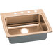 A CuVerro antimicrobial copper drop-in sink with two faucet holes on a counter.
