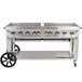 A large Crown Verity stainless steel grill with wheels.