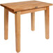 A John Boos natural maple wood table with legs.