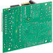 A green Main Street Equipment relay control board with two small holes.