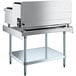 A stainless steel Cooking Performance Group countertop range on a stainless steel stand.