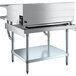 A stainless steel Cooking Performance Group griddle on a stainless steel stand with a shelf above.
