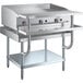 A stainless steel Cooking Performance Group gas griddle on a stainless steel Regency Equipment stand.