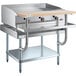 A stainless steel countertop with a griddle and shelves.