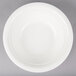 A CAC porcelain serving bowl in white on a gray surface.