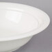 A CAC super bright white porcelain serving bowl with a rim.