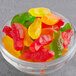 A bowl of Kervan assorted colored gummy fish candy.