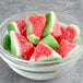 A bowl of Kervan watermelon shaped gummy candy slices.