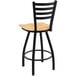 A Holland Bar Stool Jackie Ladderback Swivel Bar Stool with a black frame and natural maple seat.