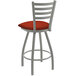 A white Holland Bar Stool swivel bar stool with a red seat and backrest.