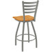 A Holland Bar Stool Jackie ladderback swivel bar stool with a wooden seat and metal back.