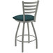 A Holland Bar Stool bar stool with a teal cushion and backrest with an anodized nickel finish and blue and white patterned seat.