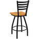 A Holland Bar Stool Jackie Ladderback swivel bar stool with black wrinkle finish and medium oak seat.