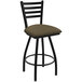 A black Holland Bar Stool ladderback swivel bar stool with a cork seat.