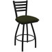 A black Holland Bar Stool ladderback swivel bar stool with a green pine seat.