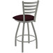 A white Holland Bar Stool ladderback counter stool with a burgundy cushion.