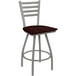 A Holland Bar Stool Jackie ladderback counter stool with a dark cherry oak seat and an anodized nickel frame.