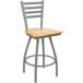A Holland Bar Stool Jackie ladderback swivel counter stool with a natural maple seat and an anodized nickel finish.