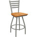 A Holland Bar Stool Jackie Ladderback Swivel Bar Stool with a medium maple seat and an anodized nickel finish.