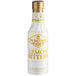 A white Fee Brothers bottle with gold text for lemon bitters.
