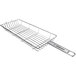 A stainless steel Mibrasa wire grill basket with a handle.