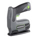 A black and grey Genesis cordless electric stapler on a table.
