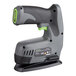 A black and grey Genesis cordless electric stapler/nailer on a table.