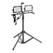 A white adjustable tripod stand with two Genesis dual-head LED work lights on it.