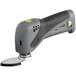 A Genesis cordless oscillating tool with a green and black blade.