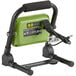 A green and black PowerSmith LED work light with a black handle and charger.