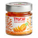 A jar of Toschi Orange Peels in syrup with a white label.