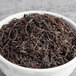 A bowl of Davidson's Organic Ceylon Orange Pekoe Black Loose Leaf Tea.