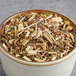 A bowl of Davidson's Organic Tulsi Signature Spice Herbal Loose Leaf Tea.